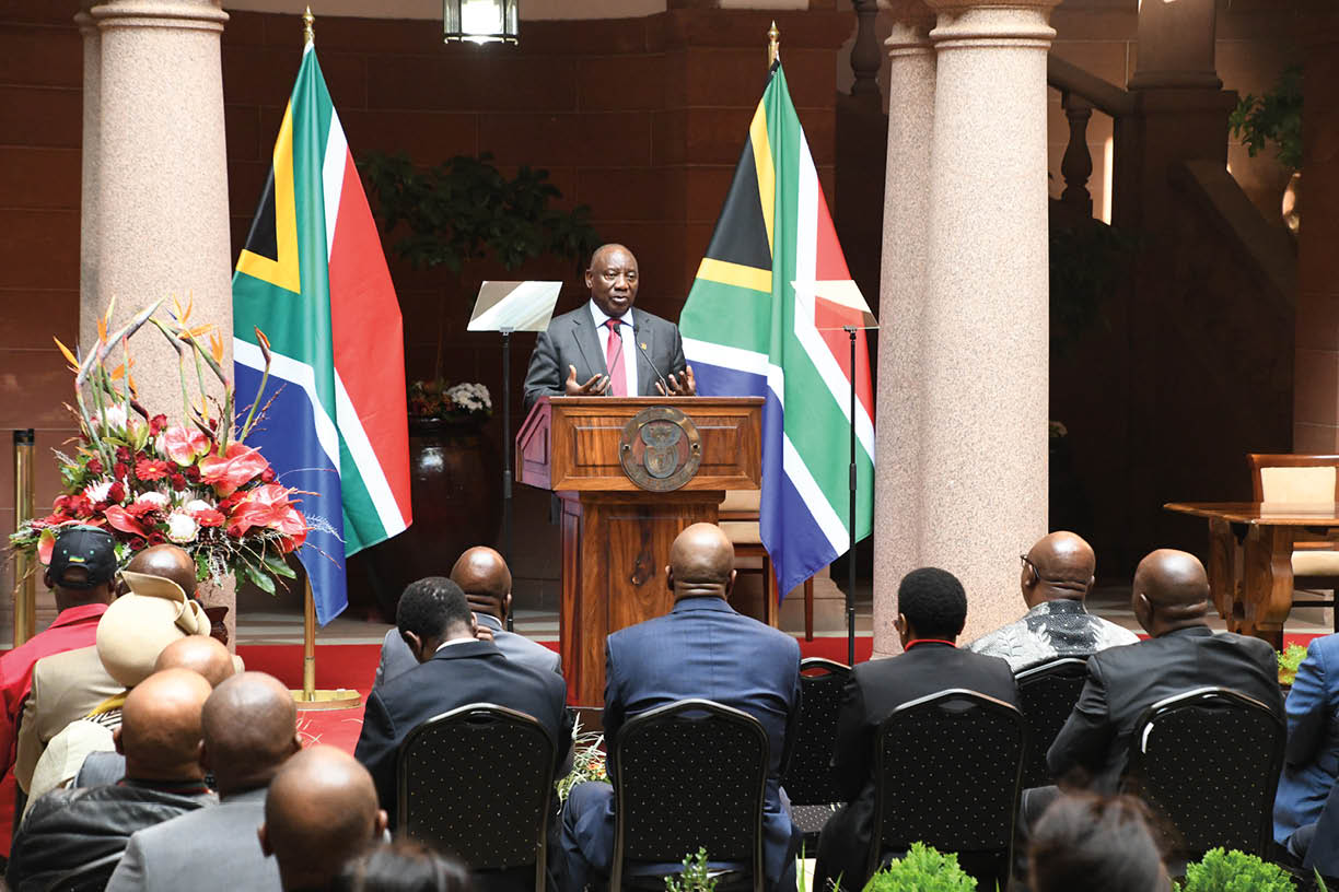 PRETORIA, SOUTH AFRICA - MAY 15: President Cyril Ramaphosa and delegates at the public signing into law of the National Health Insurance (NHI) Bill at Union Buildings on May 15, 2024 in Pretoria, South Africa. The bill aims to direct the transformation of South Africa's health care system to achieve universal coverage for health services and overcome critical socio-economic imbalances and inequities of the past. (Photo by Frennie Shivambu/Gallo Images via Getty Images).