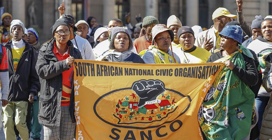 JOHANNESBURG, SOUTH AFRICA - MAY 23: Members of South African National Civics Organisation (SANCO) march at the Gauteng Provincial March on May 23, 2025 in Johannesburg, South Africa. The group protested over bad roads, lack of housing, and rising crime. (Photo by Sharon Seretlo/Gallo Images via Getty Images)