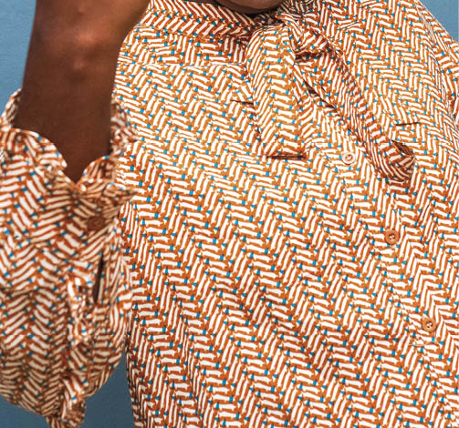 A young African American female gesturing with her fist - female empowerment concept